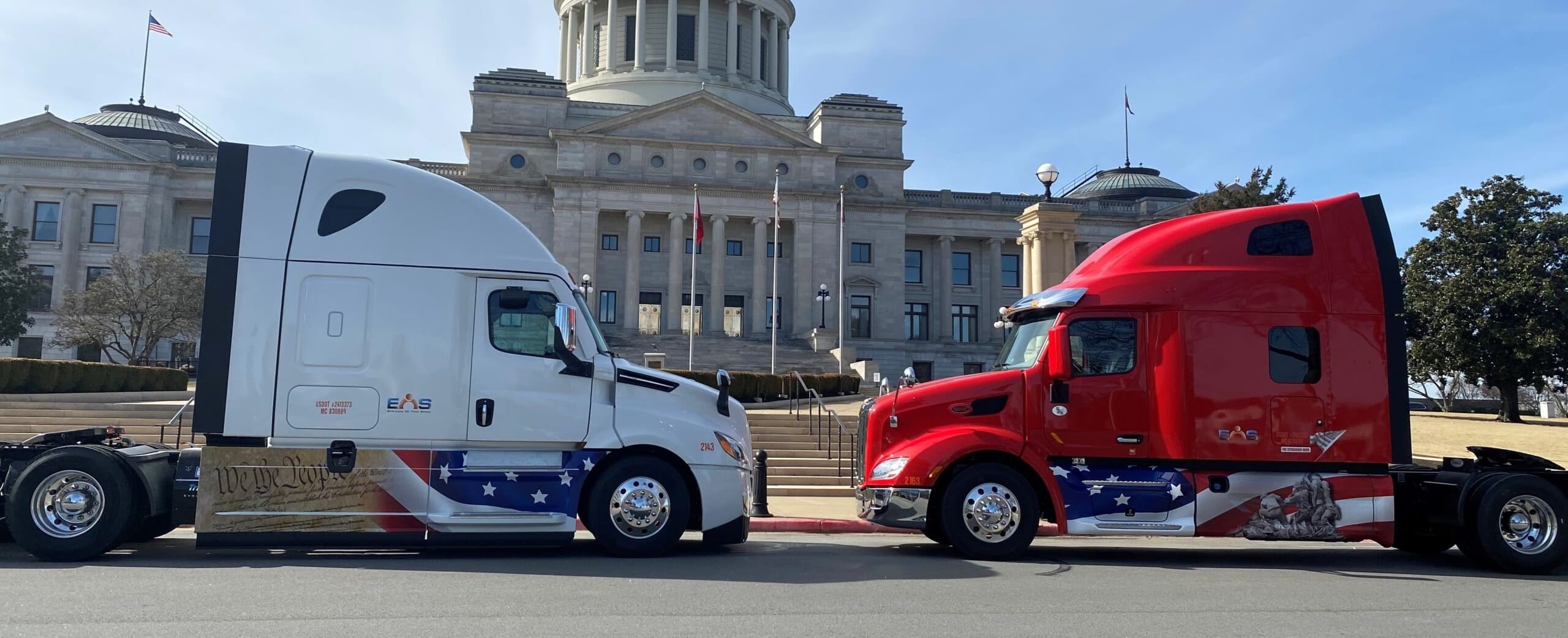 EOS Trucking tractors lined up in front of the Arkansas State Capitol